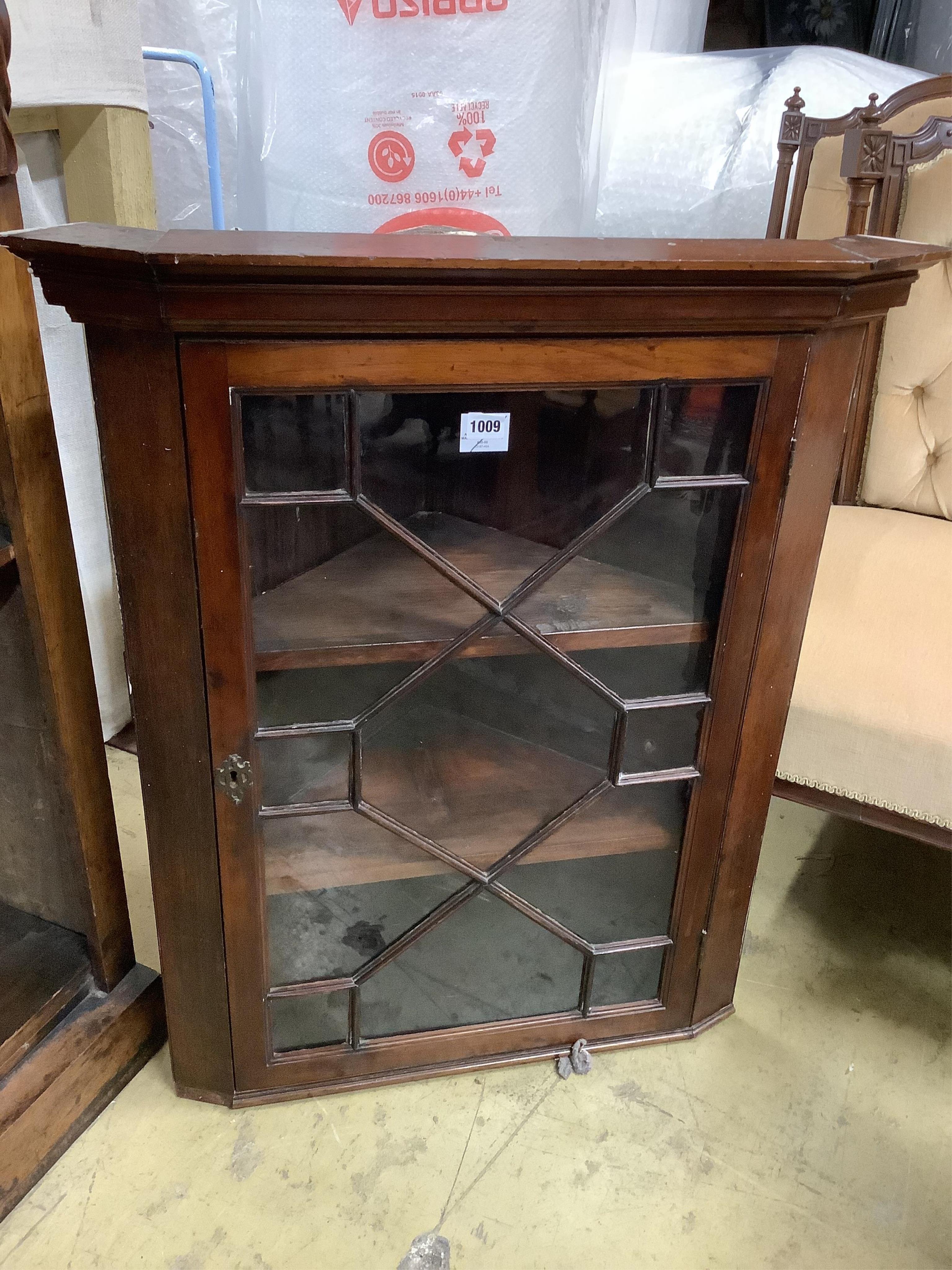 A George III glazed mahogany corner cupboard, width 72cm, depth 40cm, height 88cm and a 19th century French mahogany work table, width 37cm, depth 52cm, height 65cm